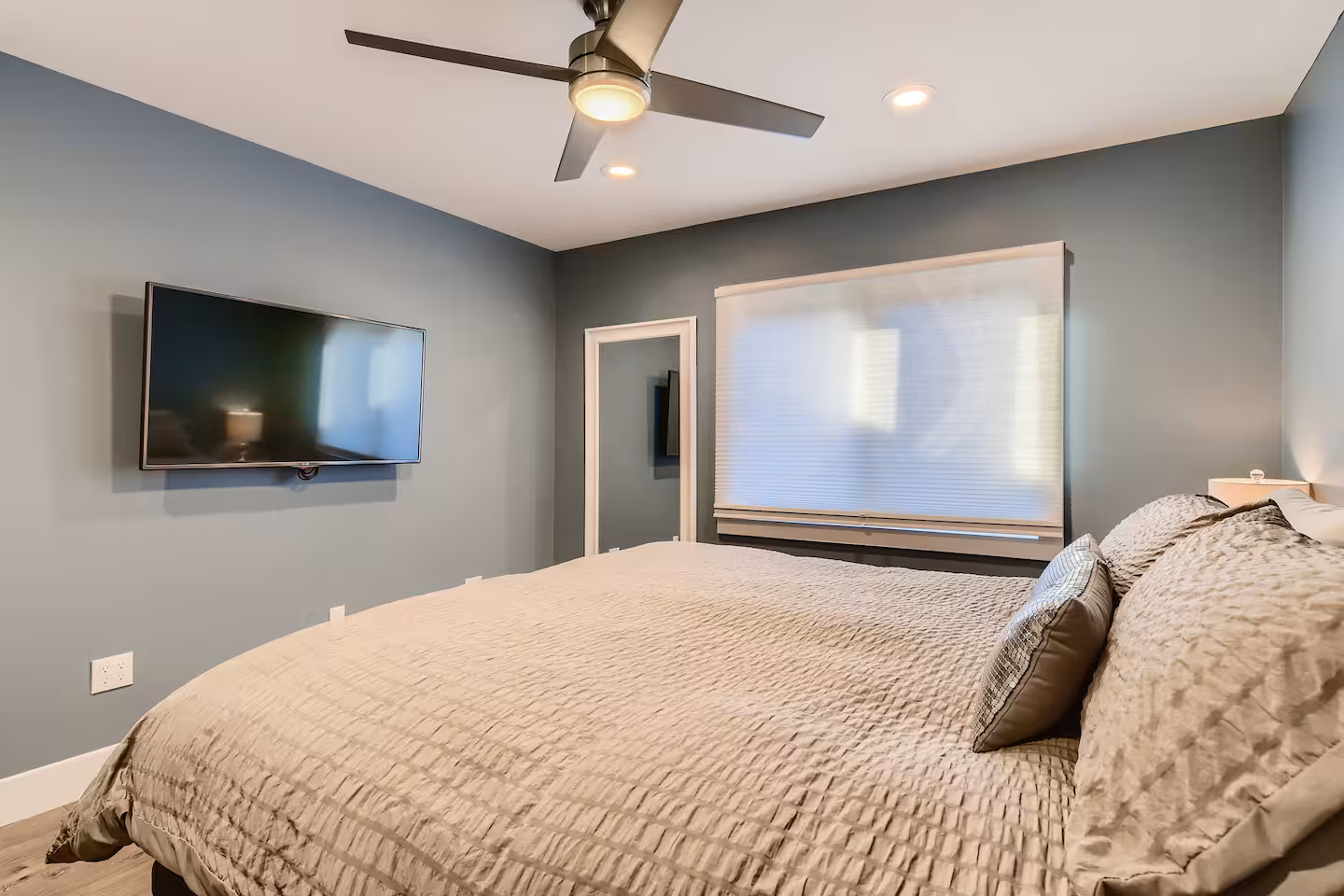 The Loft is a clean, modern bedroom with soft colors and simple design.