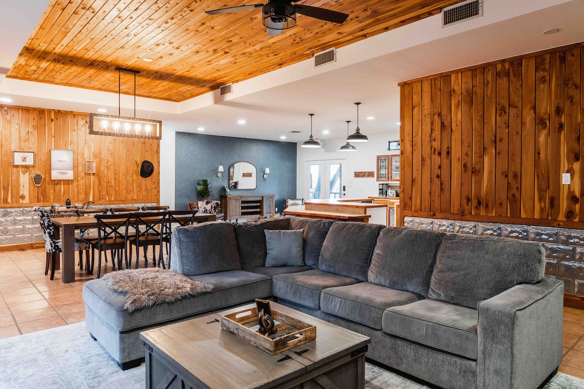 Casa Blanco living area with warm wood finishes and open layout.