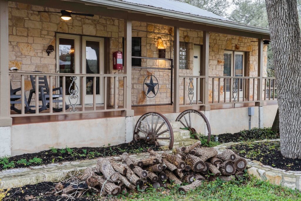 Casa Blanco front porch with rustic stone and country charm.