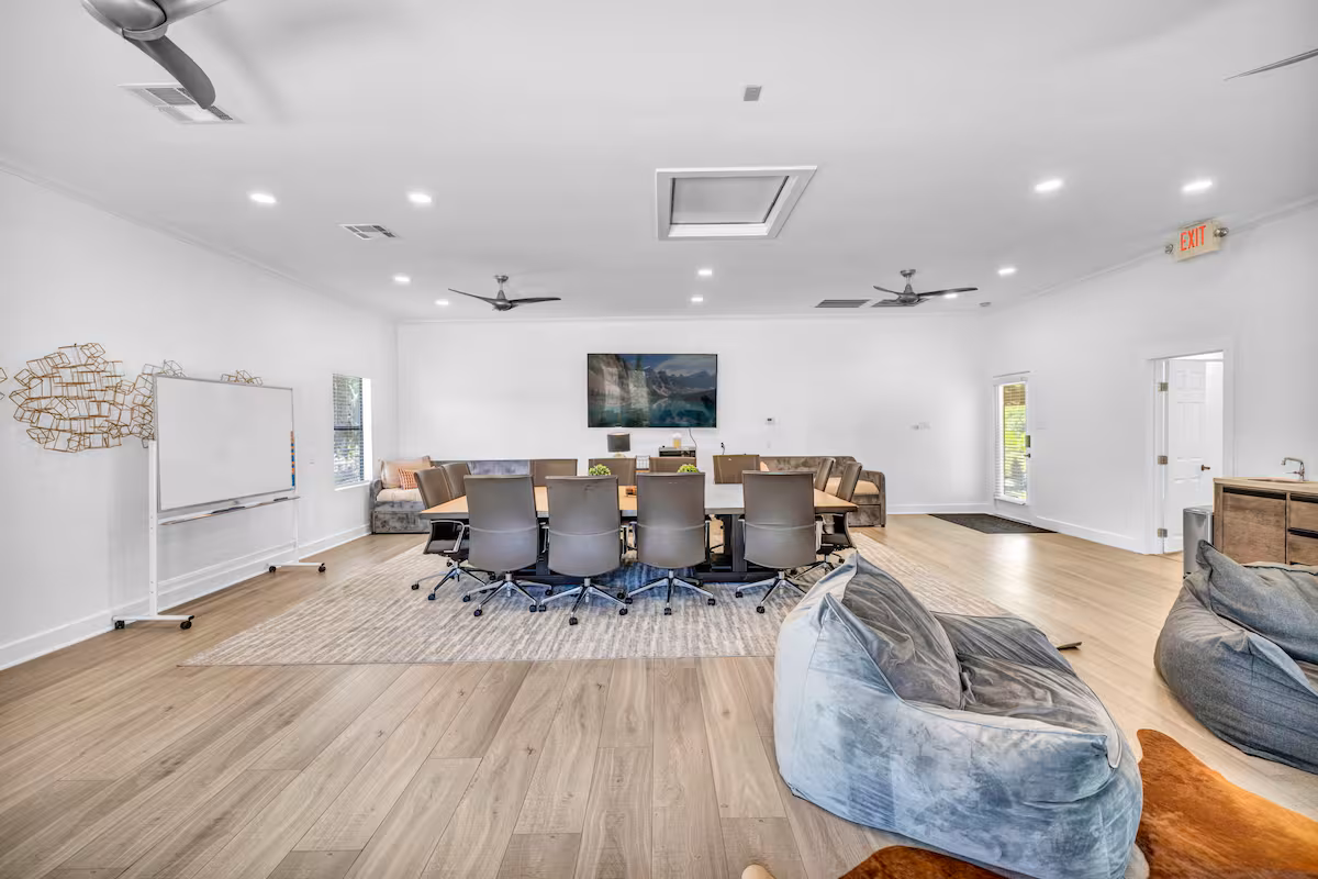 Casa Blanco conference room with large meeting table and chairs.