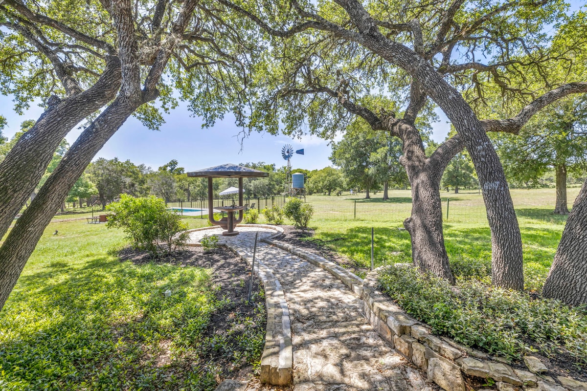 Casa Blanco outdoor gazebo with stone path and oak trees.