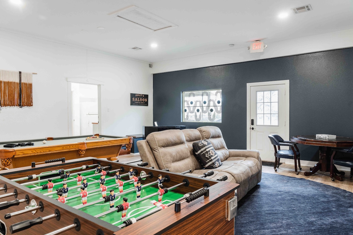 Casa Blanco game room with foosball table, pool table, and seating.